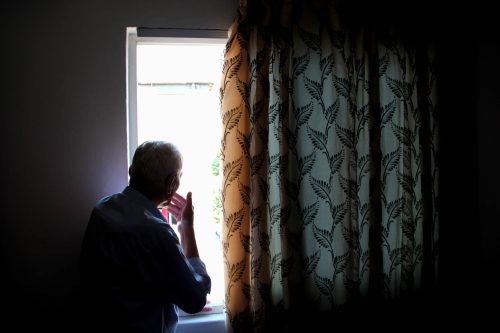 sad quotes: old man looking out the window