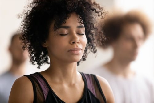 sad quotes: woman closing her eyes meditating