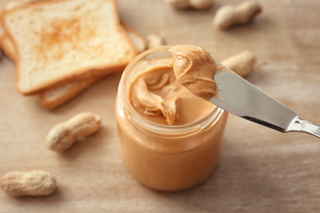 knife with jar of peanut butter