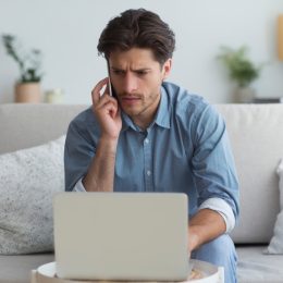 concerned man talking on phone