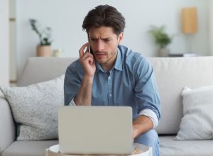 concerned man talking on phone