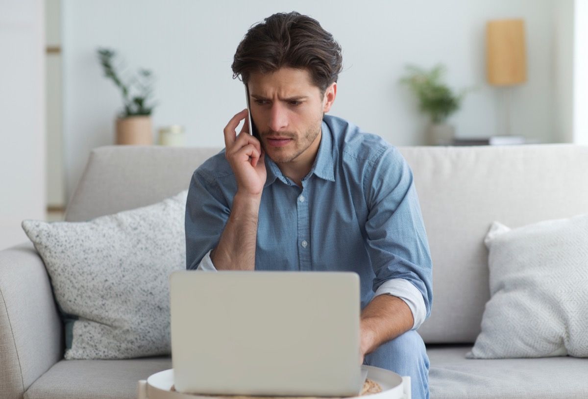 concerned man talking on phone