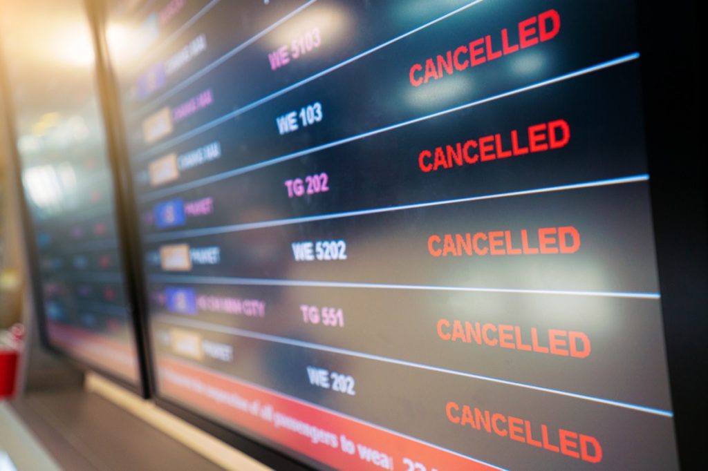 flight cancellations displayed at airport