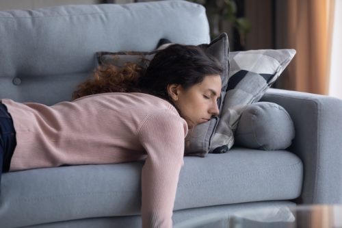 Woman asleep on the couch