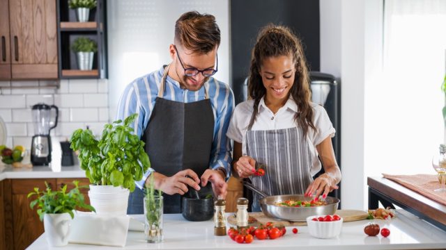 couple cooking meal together