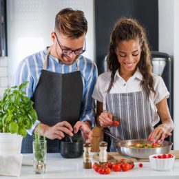 couple cooking meal together
