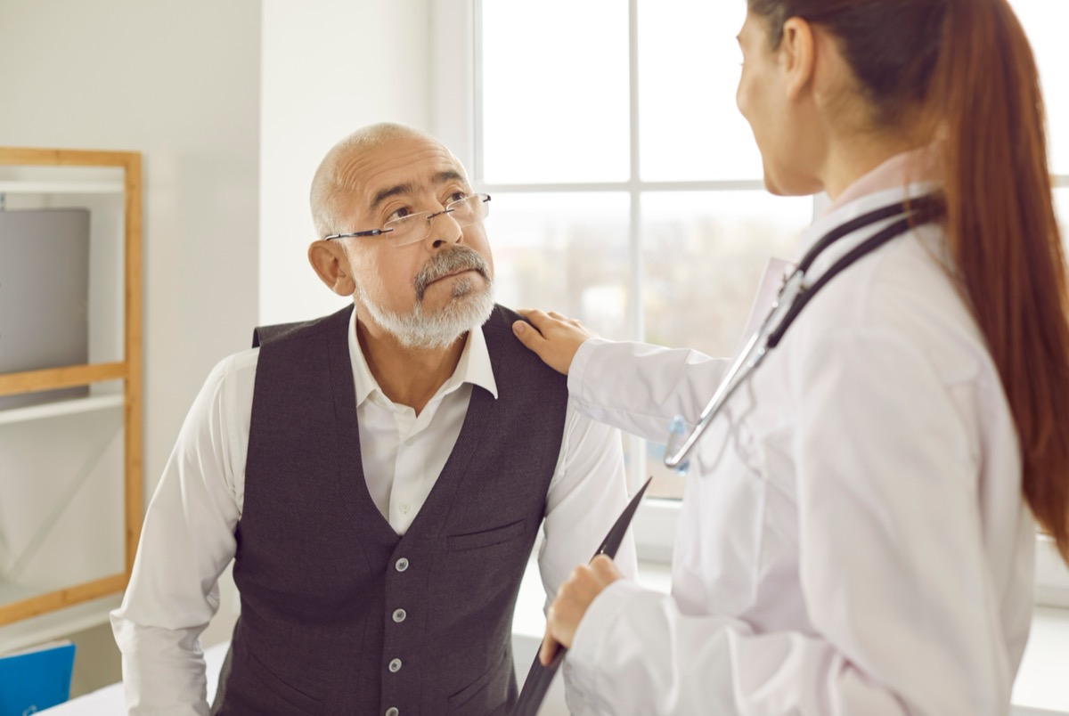 A doctor advises an elderly patient