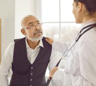doctor consulting elderly patient