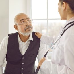 doctor consulting elderly patient