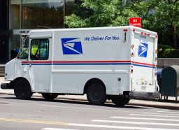 USPS van parked along the Fifth Avenue in New York City. USPS (the United States Postal Service)
