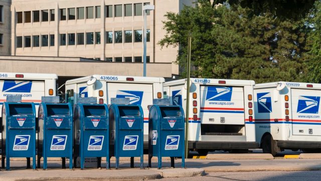 Delivery vehicles parked at the United States Post Office in downtown Fort Collins. With almost 600,000 employees, the United States Postal Service is the second largest civilian employer in the United States.