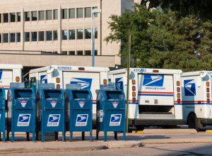 Delivery vehicles parked at the United States Post Office in downtown Fort Collins. With almost 600,000 employees, the United States Postal Service is the second largest civilian employer in the United States.