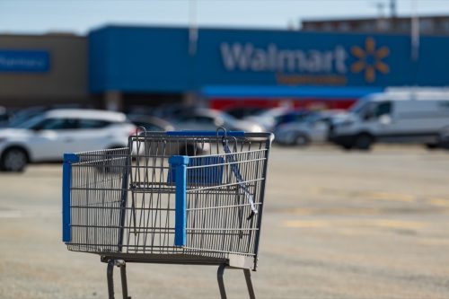 A shopping cart sits in the foreground of a Walmart Supercentre store located in Bayers Lake Business Park.