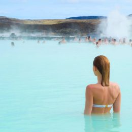 woman enjoying blue lagoon hot springs in Iceland