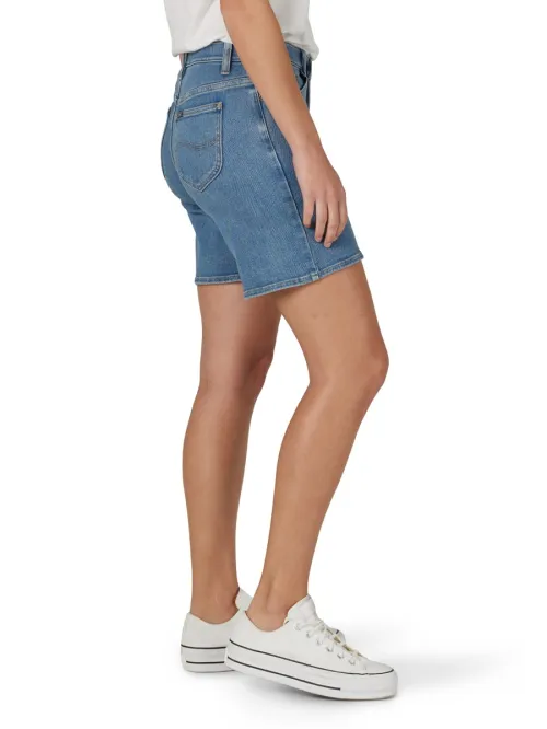 View of a woman's legs wearing Lee denim shorts.