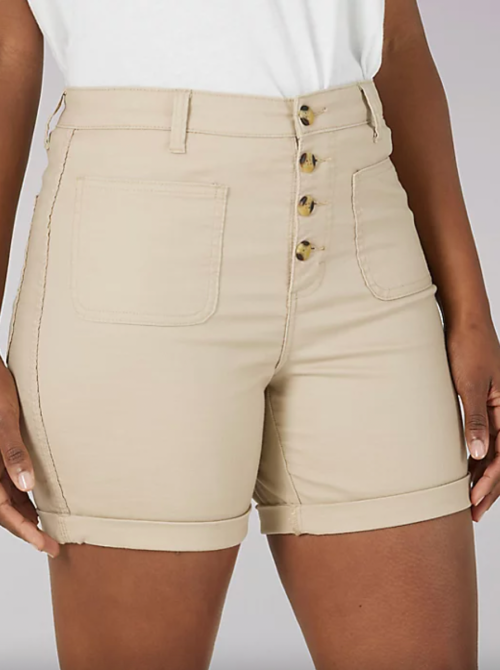 View of a woman's legs wearing Lee high-rise chino shorts.