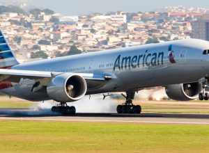 An American Airlines plane landing at an airport
