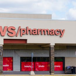 CVS Pharmacy storefront with a stop sign in front