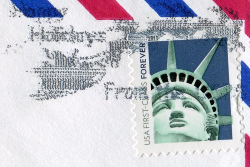 Postage stamp printed in USA shows the image of the Statue of Liberty. USA FIRST CLASS FOREVER WITH HAPPY HOLIDAYS MARK circa 2011