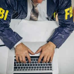 FBI agent on computer