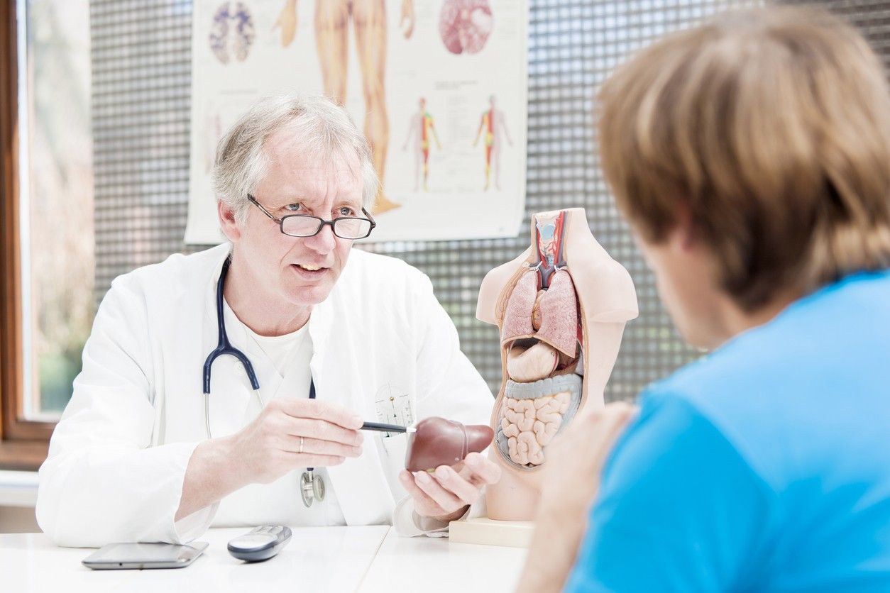 Doctor talking to a patient about the liver.