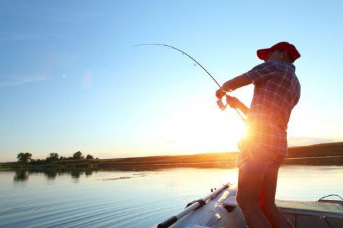 man fishing at lake