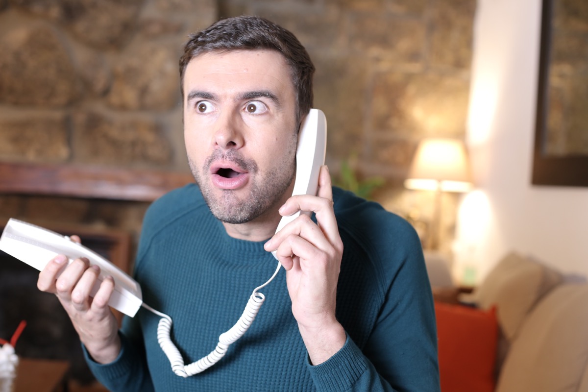 Nosy man gossiping on the phone