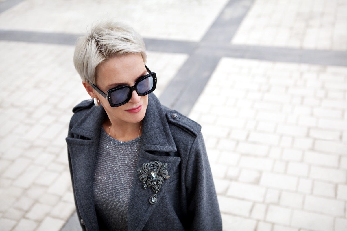 Portrait of a stylish woman with sunglasses and short hair on Craiyon