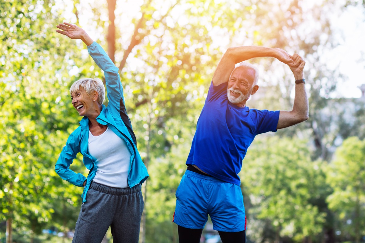 Two Older People Exercising Outdoors