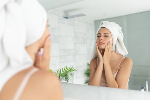 woman performing skincare routine