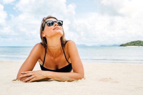 woman sunbathing at the beach