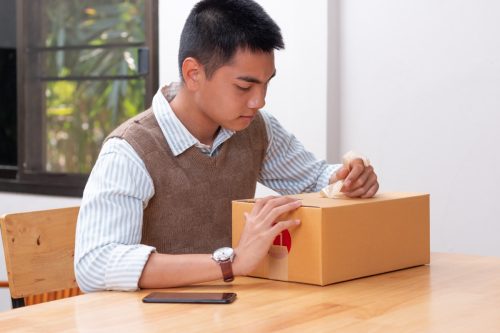 man opening a package