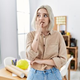 shy woman biting her nails