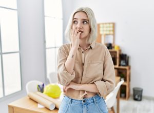 shy woman biting her nails