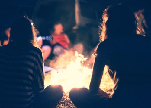 sitting around campfire