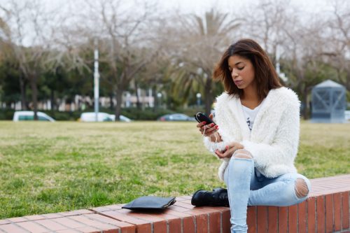 young woman using smart phone
