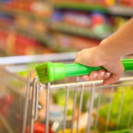 woman pushing shopping cart