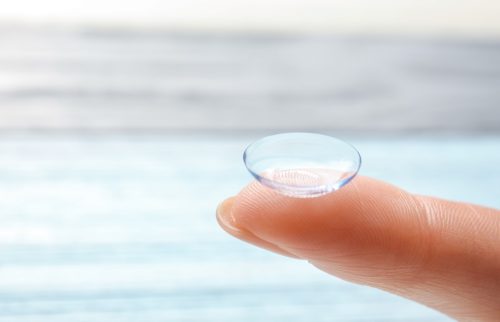finger with contact lens