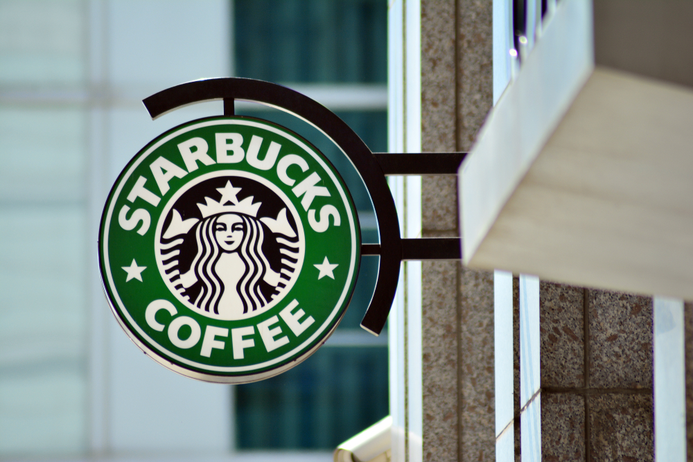 The exterior sign of a Starbucks Cafe