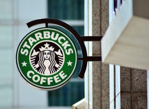The exterior sign of a Starbucks Cafe