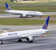 Two United Airlines planes taxiing on a runway