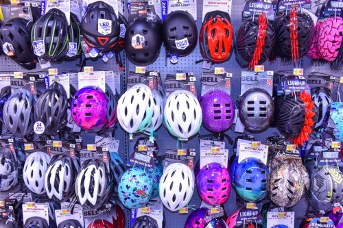 Assorted Sport Helmets on Sale Hanging at Local Walmart Store