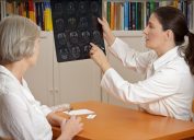 a woman with her doctor looking at a brain scan