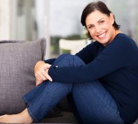 woman in jeans on couch