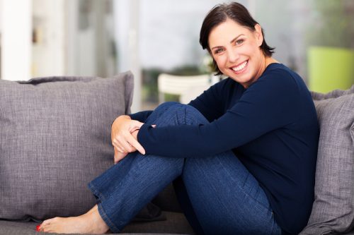 woman in jeans on couch