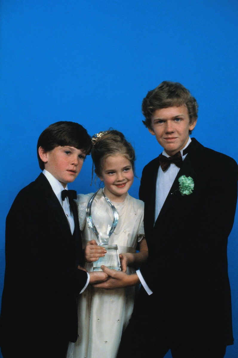 Henry Thomas, Drew Barrymore, and Robert MacNaughton in 1983