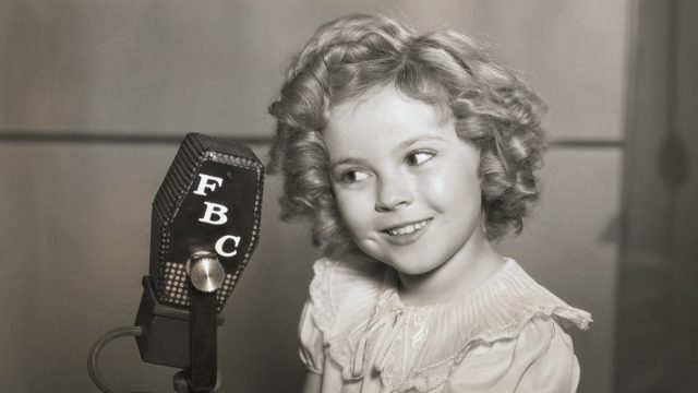 Shirley Temple with microphone