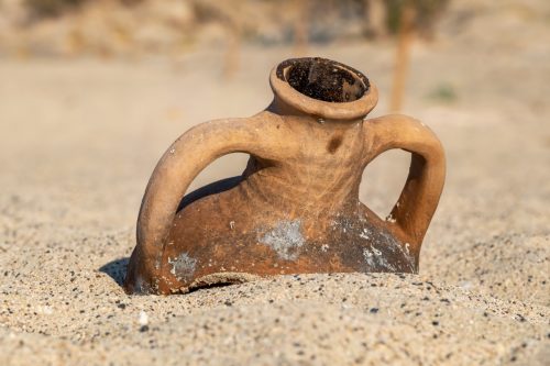 Old greek Amphora on Elafonissi beach in Crete, Greece.