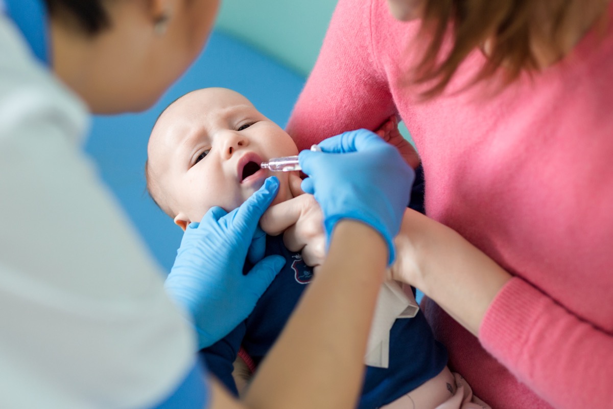 baby getting an oral polio vaccine