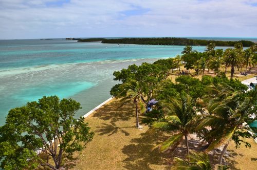 A view of Boca Chita Key in Florida's Biscayne National Park. The grassy campground is seen along the turquoise waters.